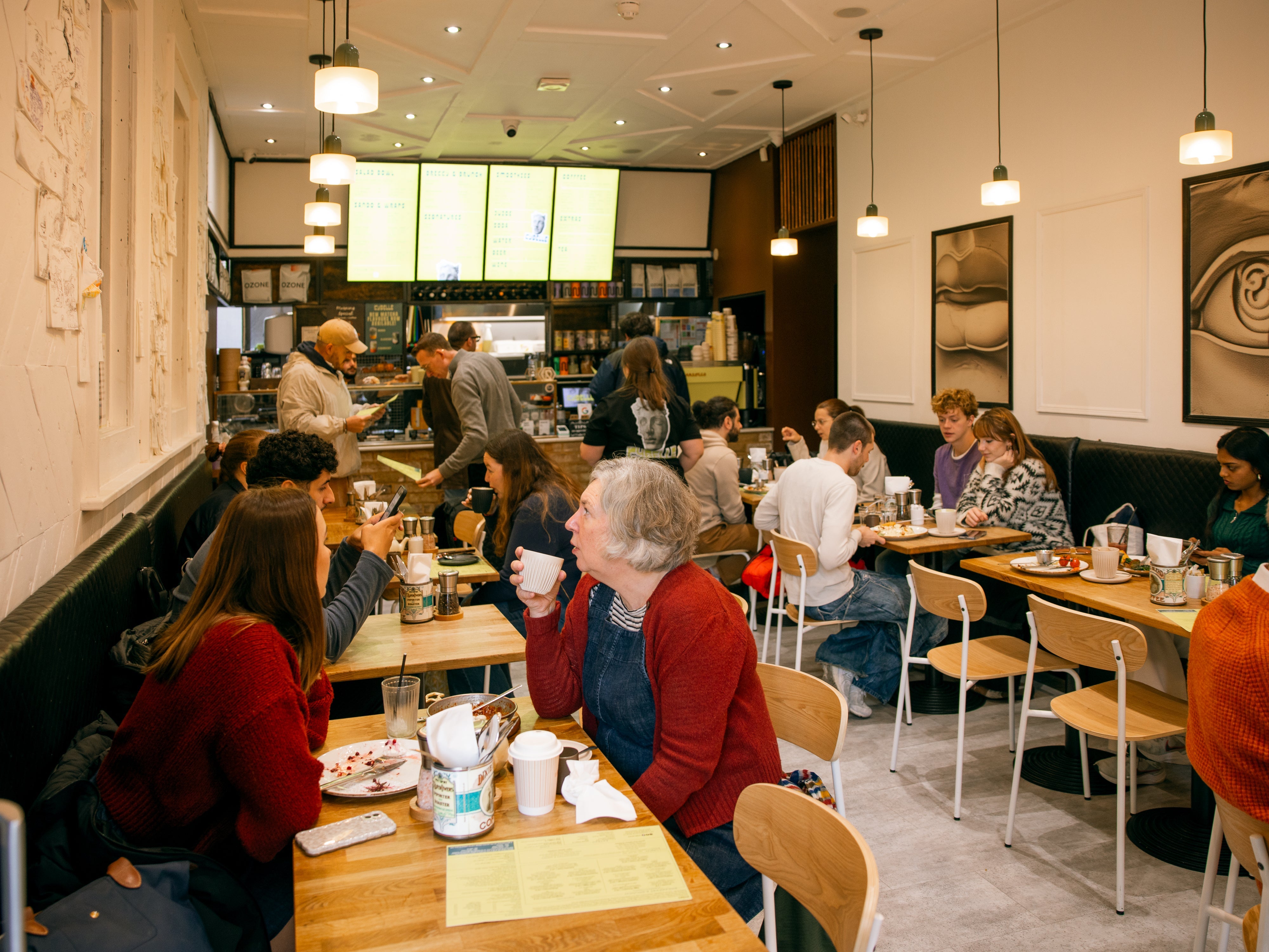 Busy dining room with full tables at dog-friendly Kybelle Café, Shoreditch