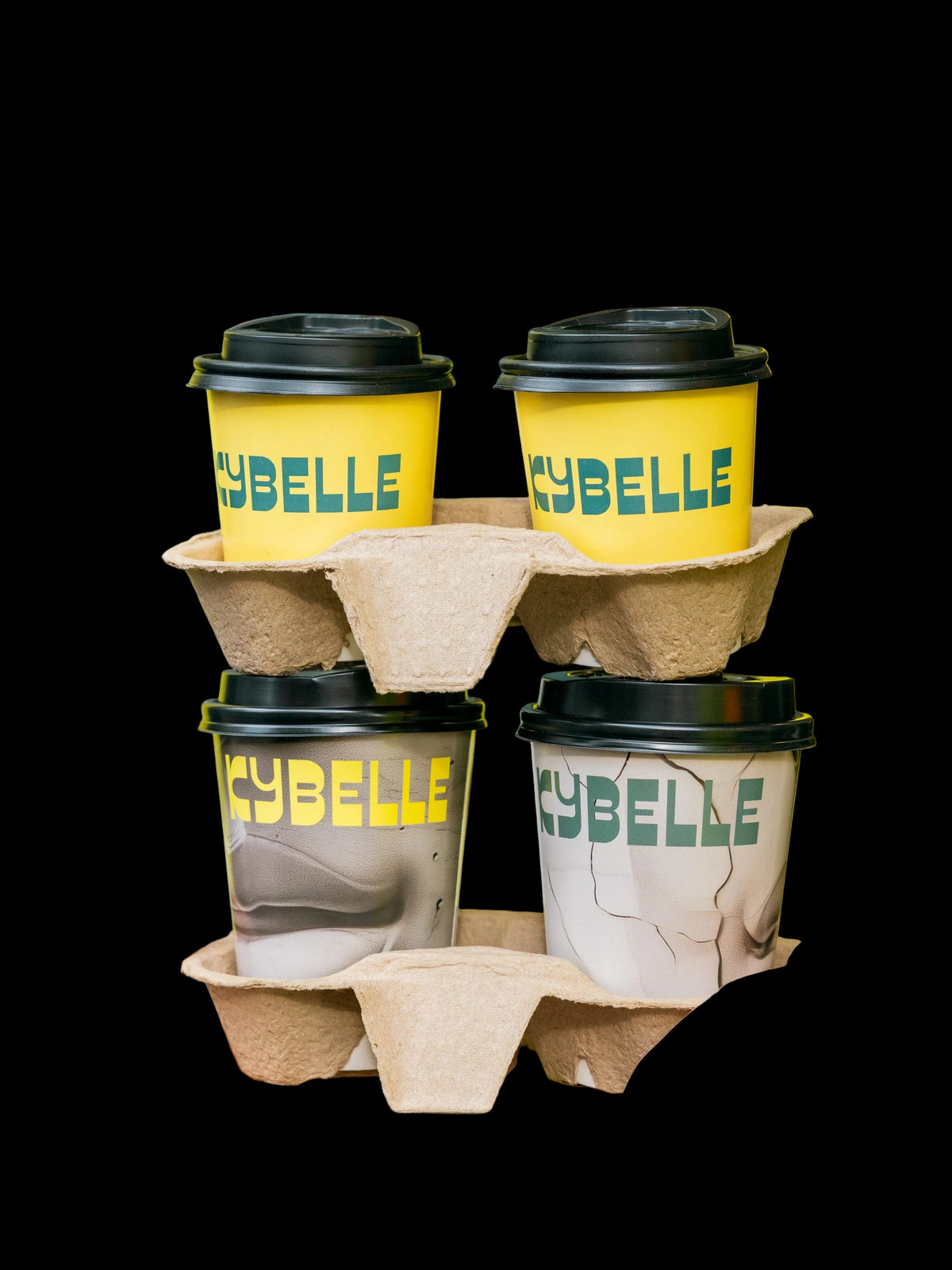 Four Kybelle-branded takeaway coffee cups in carry trays — Ozone Coffee Roasters specialty coffee at Kybelle Café, Shoreditch