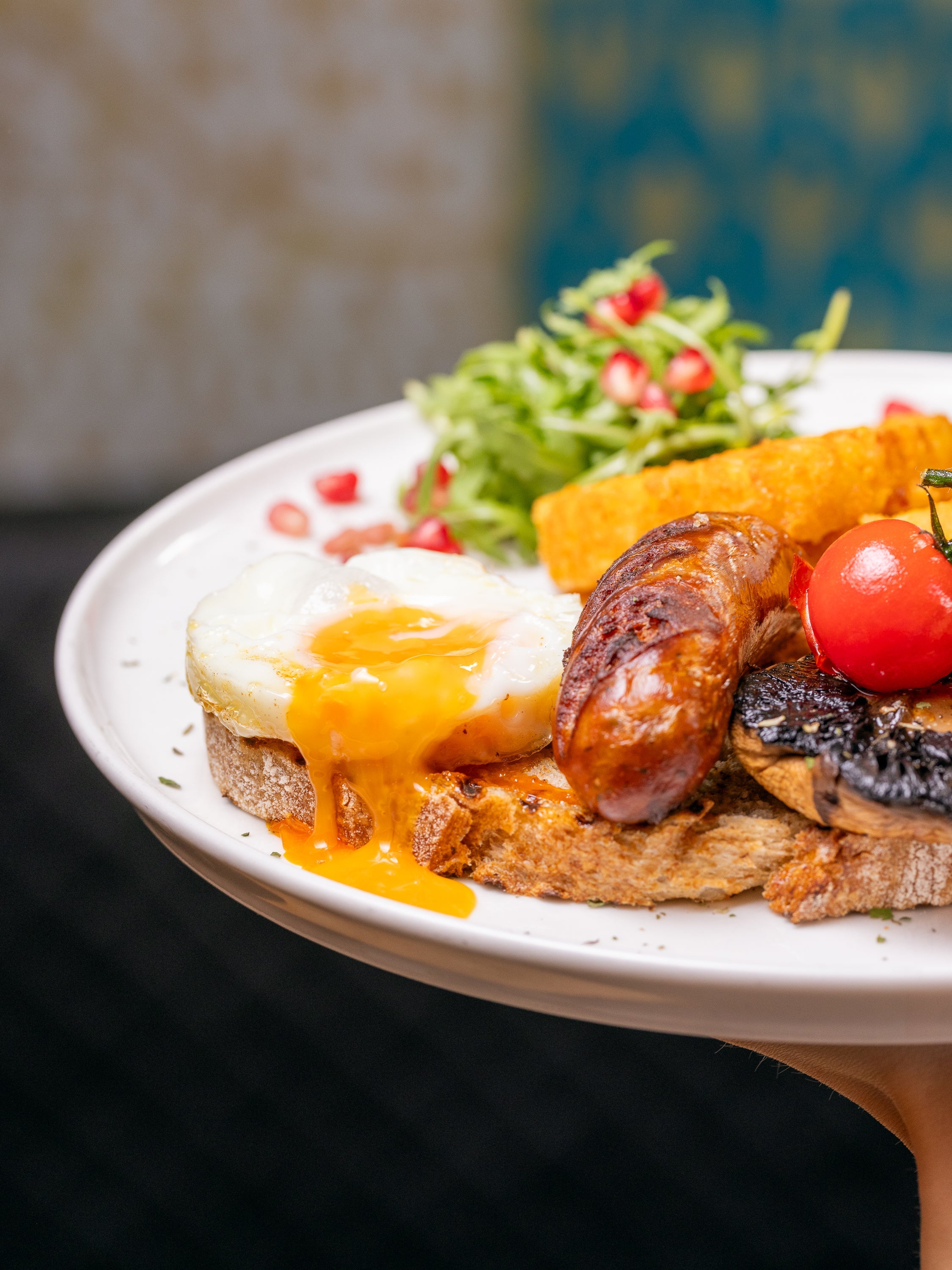 The Shoreditch Fry-Up full English breakfast — sausage, fried egg, hash brown, mushroom and tomato at Kybelle Café, Shoreditch