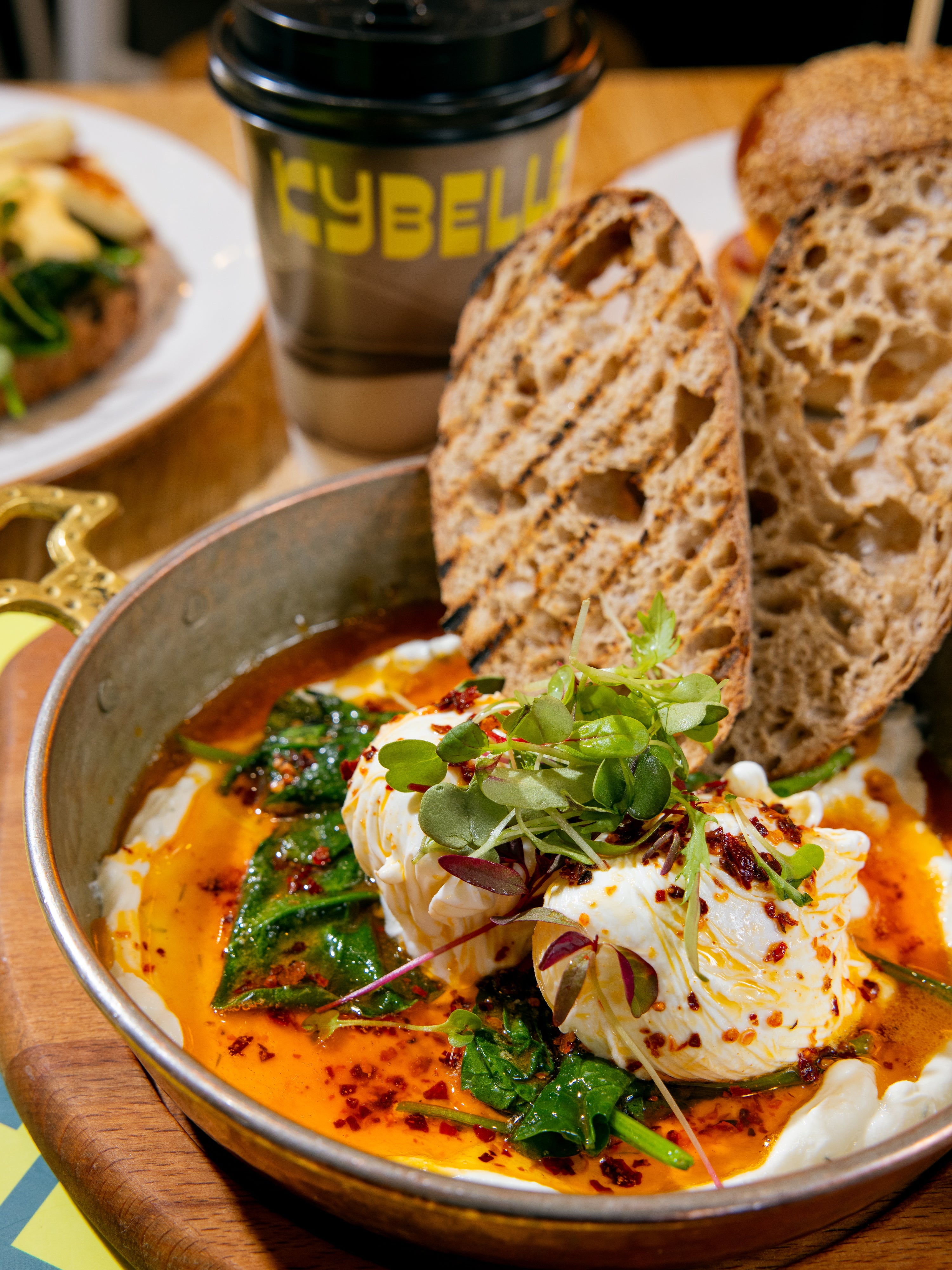 Çılbır Turkish eggs — poached eggs over garlicky yogurt with chilli butter and sourdough at Kybelle Café, Shoreditch