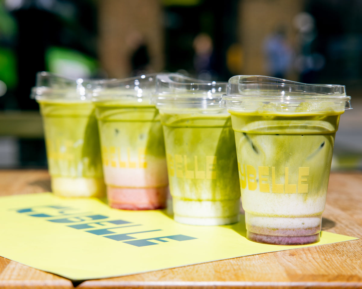 Four iced matcha lattes in Kybelle-branded cups — the Kybelle x PerfectTed matcha range at Kybelle Café, Shoreditch